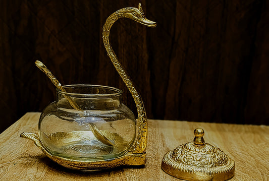 Duck glass golden with a spoon